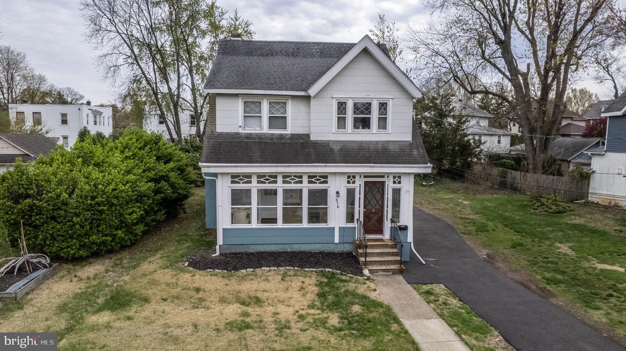 512 Jessamine Avenue Oaklyn, NJ 08107 - Photo 1 of 25 front view of a house with a yard