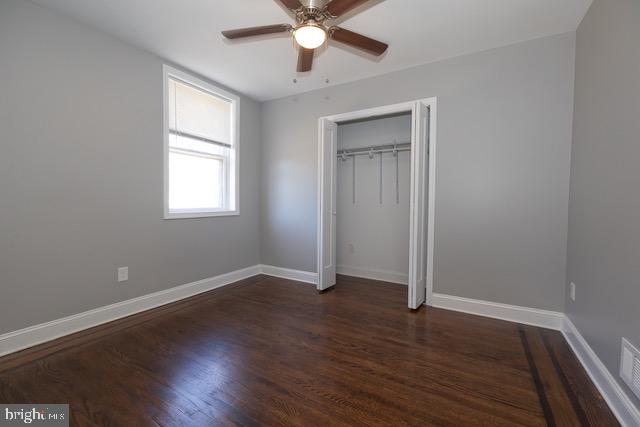 512 Jessamine Avenue Oaklyn, NJ 08107 - Photo 12 of 25 an empty room with wooden floor and windows