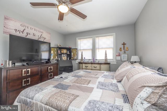 512 Jessamine Avenue Oaklyn, NJ 08107 - Photo 20 of 25 a bedroom with a large bed and a flat screen tv