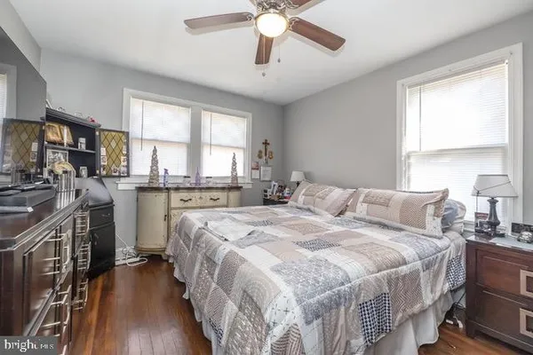 a bed room with a bed and a chandelier