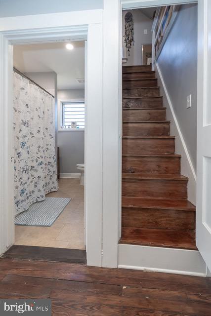 512 Jessamine Avenue Oaklyn, NJ 08107 - Photo 22 of 25 a view of a hallway with wooden floor and staircase