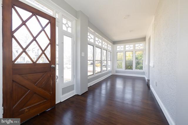 512 Jessamine Avenue Oaklyn, NJ 08107 - Photo 4 of 25 a view of an empty room with wooden floor and a window