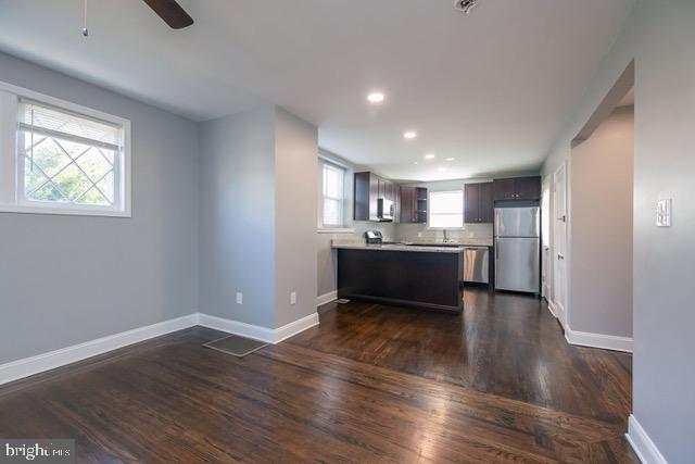 512 Jessamine Avenue Oaklyn, NJ 08107 - Photo 8 of 25 a view of kitchen with wooden floor and window