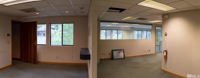 a view of a bathroom with a glass door and shower