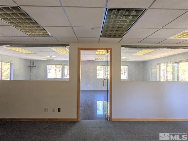 a view of a building with sitting area