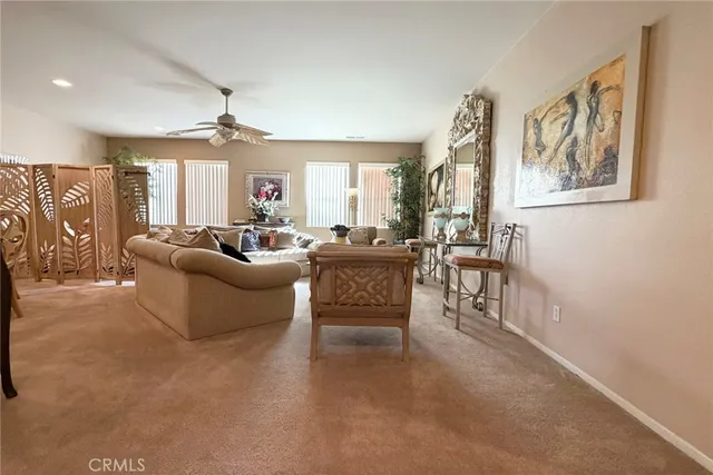 a kitchen with stainless steel appliances kitchen island granite countertop a refrigerator a oven a counter top and cabinets