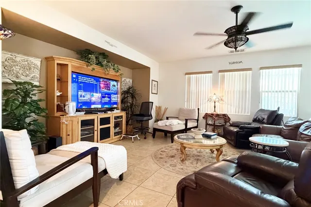 a view of a hallway with a dining table and chairs