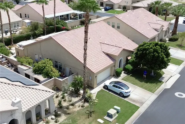 an aerial view of a house with yard swimming pool and outdoor seating