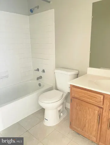 a bathroom with a toilet a sink and a bathtub