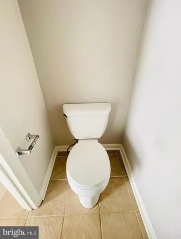 a bathroom with a toilet and a sink