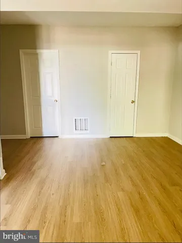 a view of room and wooden floor