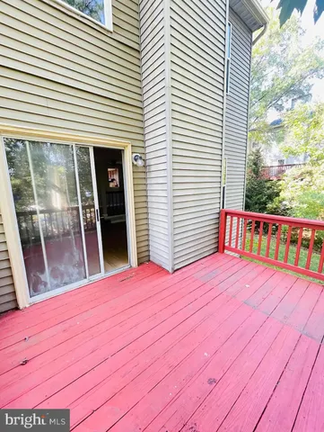a view of wooden floor and a large window