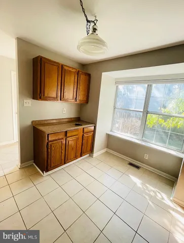 a kitchen with stainless steel appliances a sink and a stove