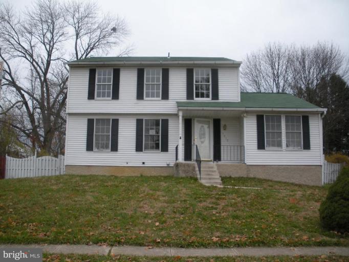7012 Glen Spring Road Windsor Mill, MD 21244 - Photo 3 of 15 a front view of a house with garden