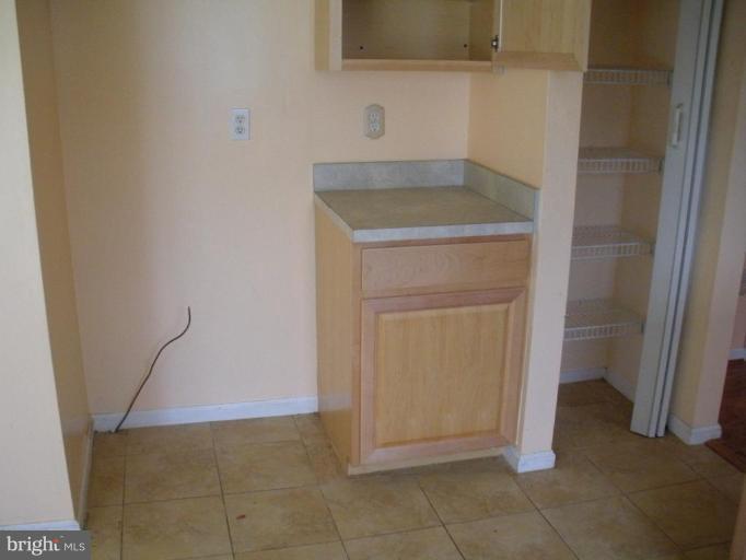 7012 Glen Spring Road Windsor Mill, MD 21244 - Photo 6 of 15 a bathroom with a sink and a mirror