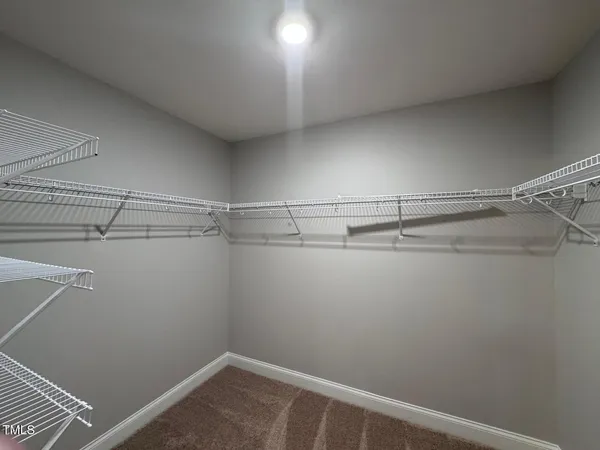 a view of a room with racks on the wall