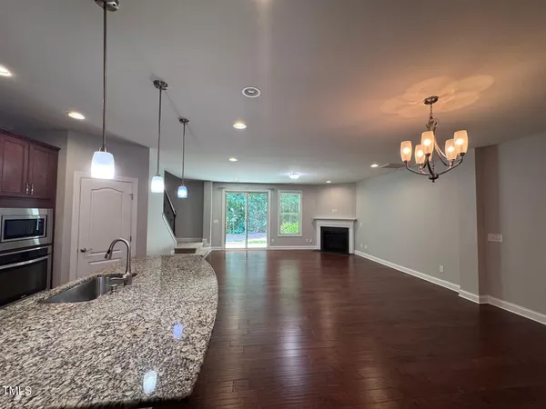a view of a kitchen with a sink chandelier and kitchen view