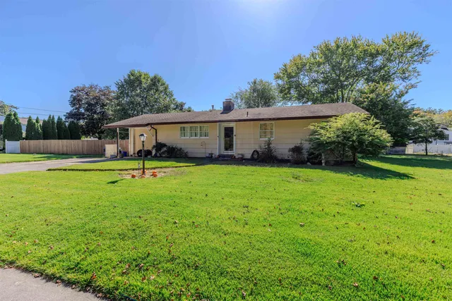 a house view with swimming pool and garden space