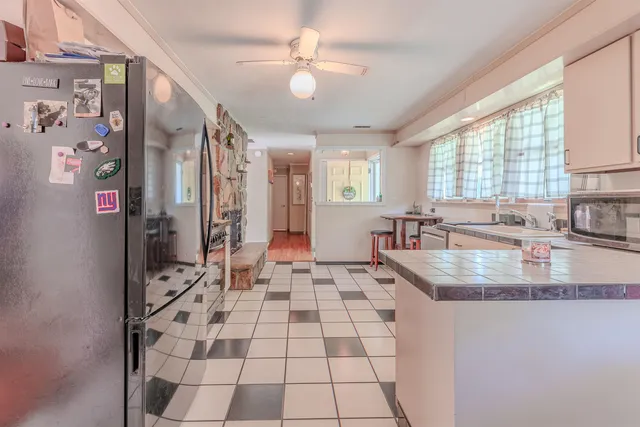 a kitchen with a sink and cabinets