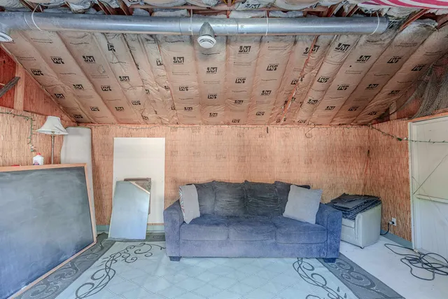 an aerial view of a house with pool outdoor seating and yard