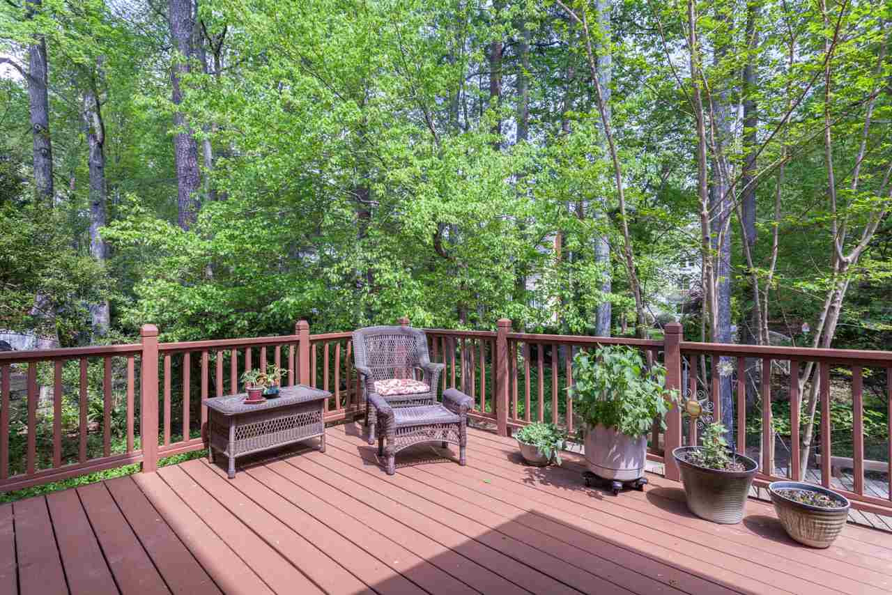 2408 Wertherson Lane Raleigh, NC 27613 - Photo 20 of 25 Perfect for grilling, entertaining and relaxing, with views of the neighboring lake and fountain. Don't forget to check out the ground-level patio as well! Deck