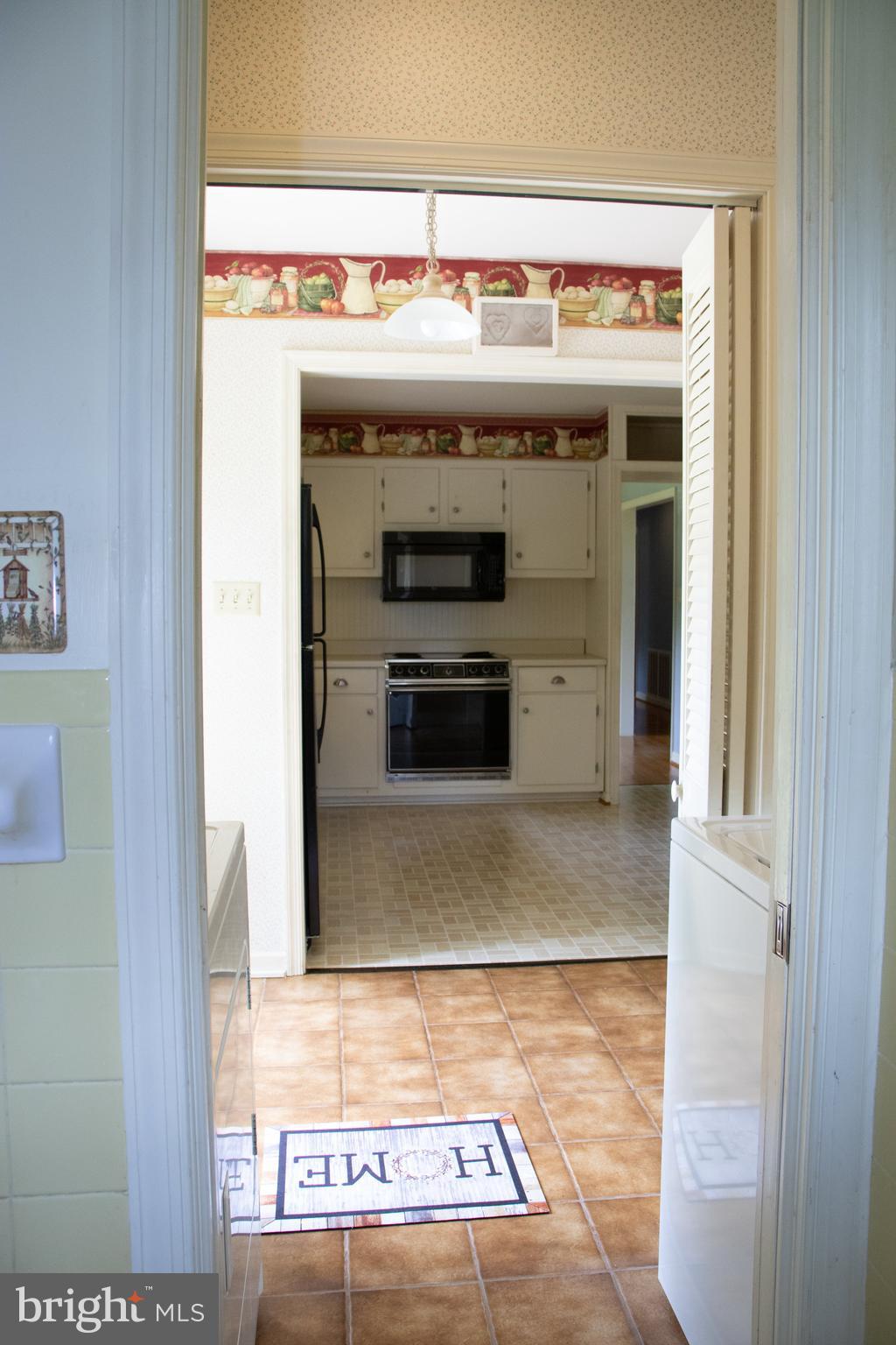 12212 Orange Plank Road Locust Grove, VA 22508 - Photo 76 of 76 Open floor plan from den to kitchen to back yard