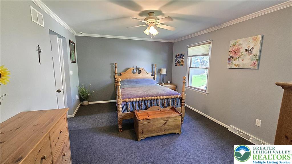 194 Springhouse Road Allentown, PA 18104 - Photo 16 of 34 This peaceful bedroom provides a comfortable retreat with ample natural light.