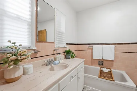 a bathroom with a sink a vanity and a mirror