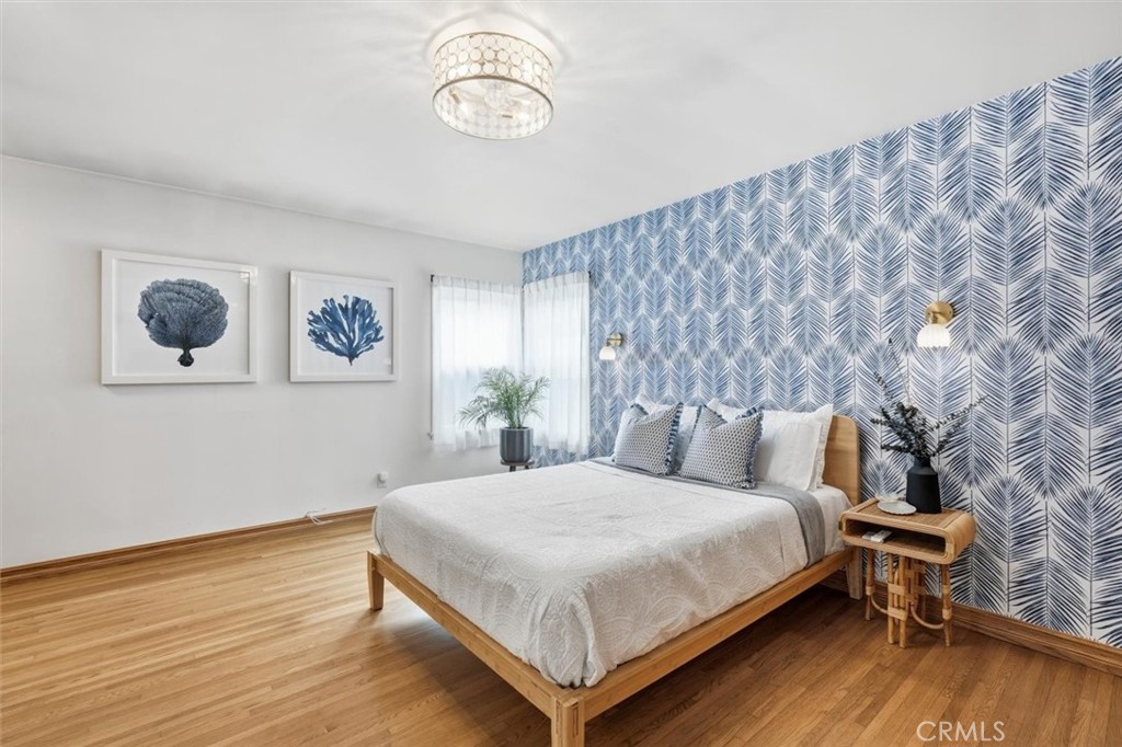 1424 Post Avenue Torrance, CA 90501 - Photo 16 of 34 a bedroom with a bed and wooden floor