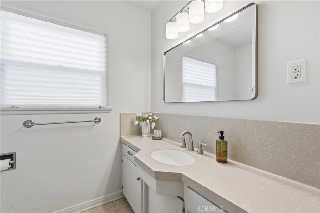 1424 Post Avenue Torrance, CA 90501 - Photo 19 of 34 a bathroom with a sink and a mirror
