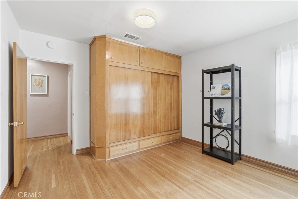 1424 Post Avenue Torrance, CA 90501 - Photo 23 of 34 an empty room with wooden floor and closet