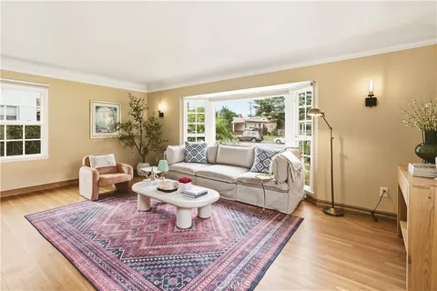 a living room with furniture and a rug
