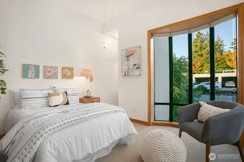 a bedroom with a bed and a cabinets