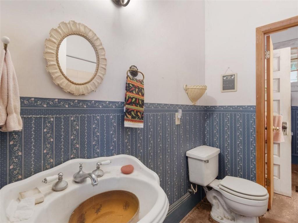 481 Turner Road Concord, GA 30206 - Photo 19 of 44 a bathroom with a toilet a sink and a mirror