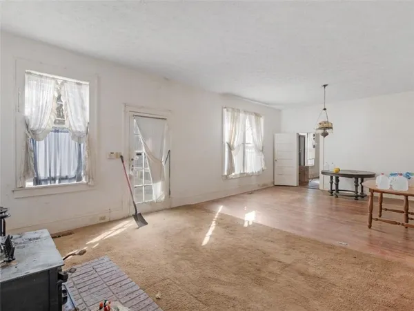 a view of livingroom with furniture and windows