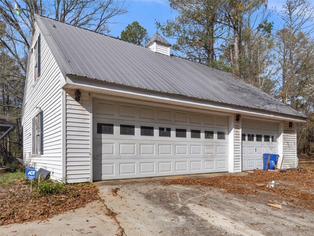481 Turner Road Concord, GA 30206 - Photo 2 of 44 a front view of a house with a yard and garage
