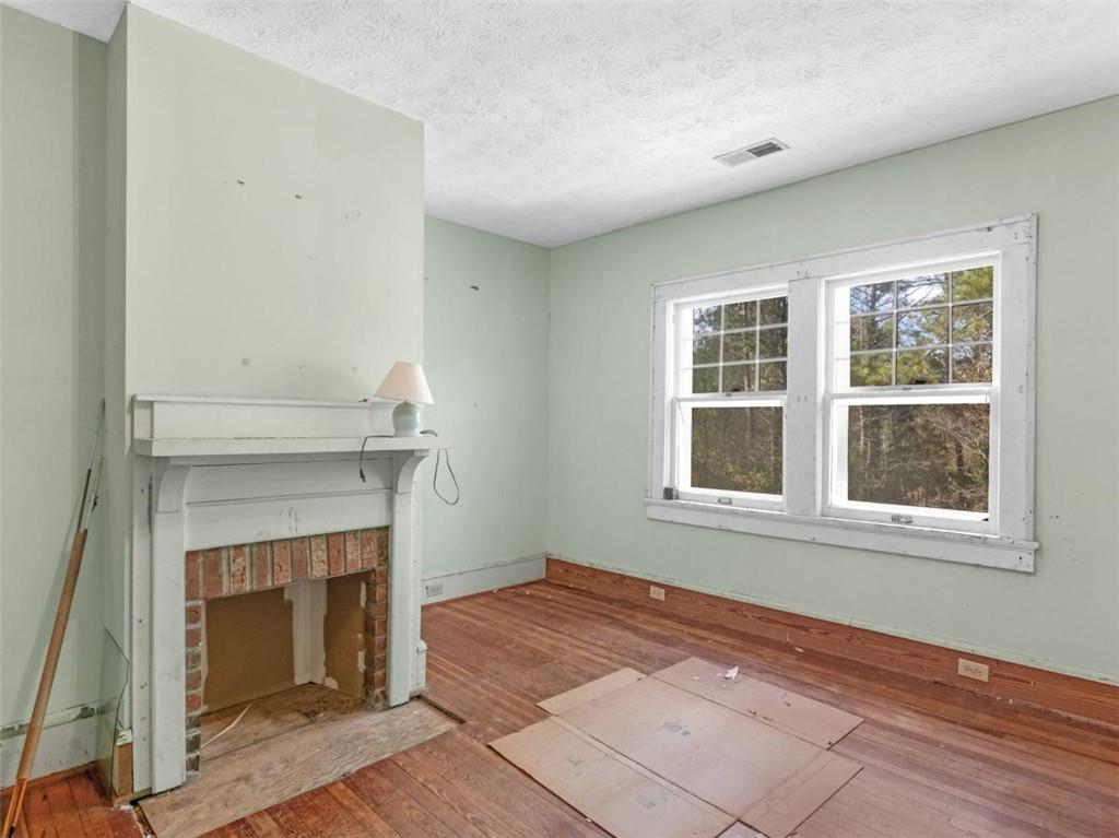 481 Turner Road Concord, GA 30206 - Photo 24 of 44 a view of an empty room with wooden floor and a window
