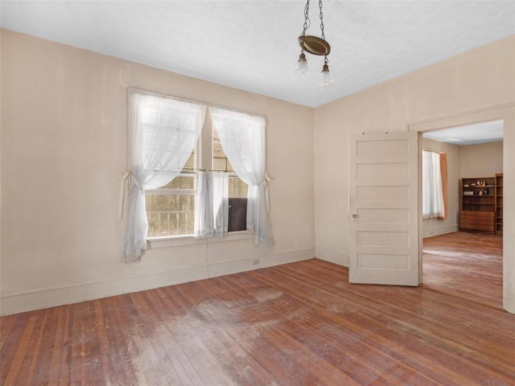 481 Turner Road Concord, GA 30206 - Photo 26 of 44 an empty room with wooden floor cabinet and windows