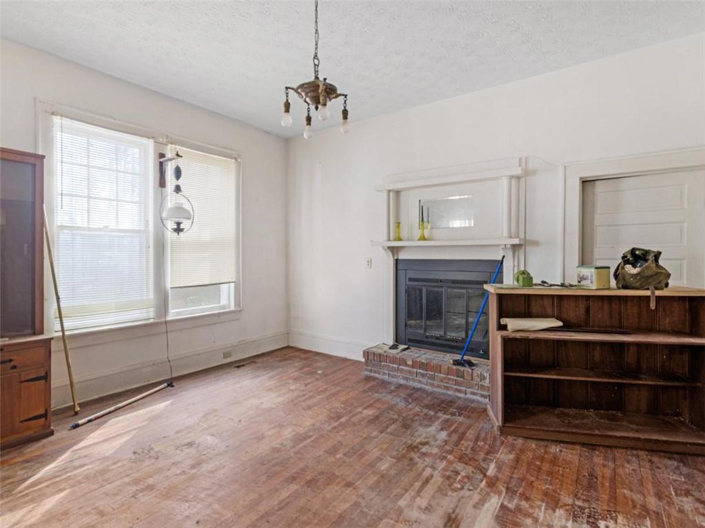 481 Turner Road Concord, GA 30206 - Photo 29 of 44 a view of a livingroom with a fireplace a ceiling fan and windows
