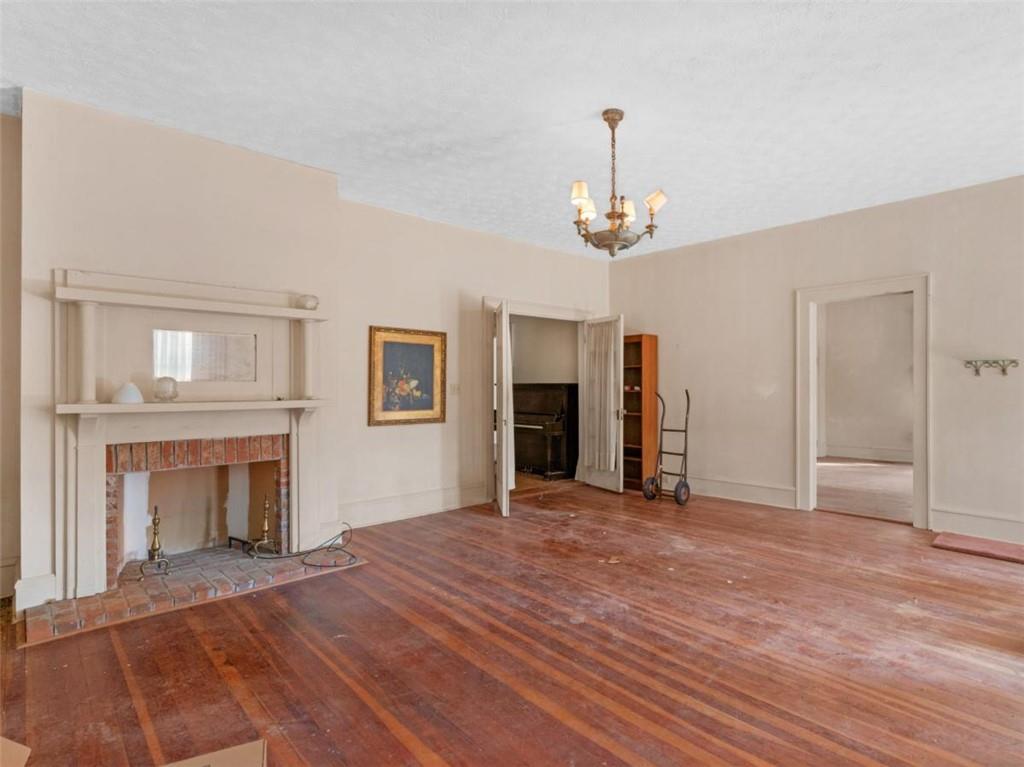 481 Turner Road Concord, GA 30206 - Photo 30 of 44 a view of an empty room with a fireplace and a window