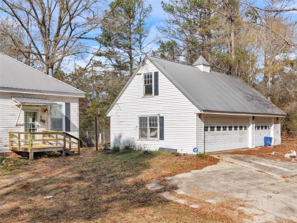 481 Turner Road Concord, GA 30206 - Photo 3 of 44 a view of a house with a yard chairs and floor to ceiling window