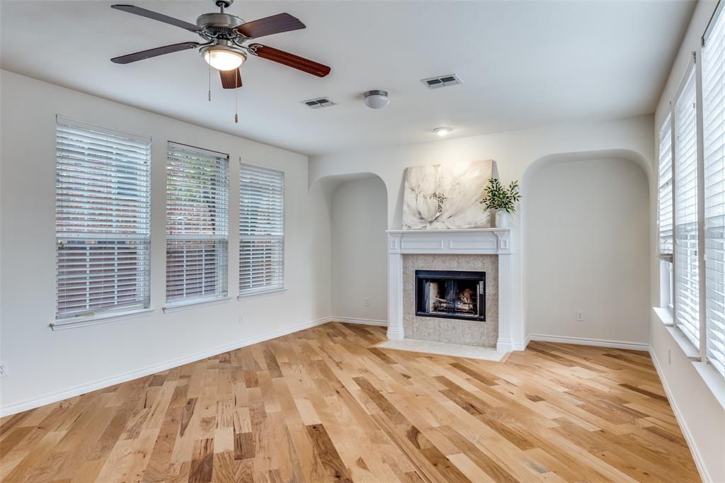 2025 Testament Trail Plano, TX 75074 - Photo 3 of 29 a view of an empty room with a window and fireplace