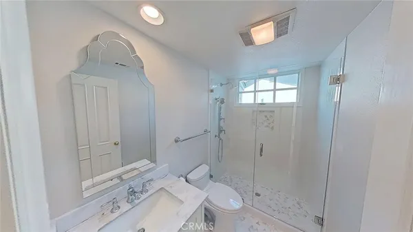 a kitchen with a wooden floor and a sink