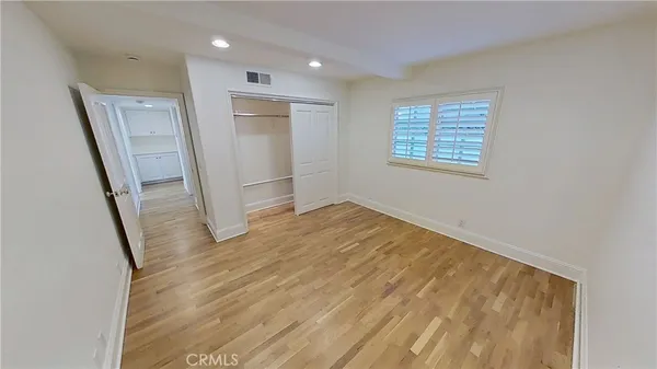 a view of hallway with wooden floor
