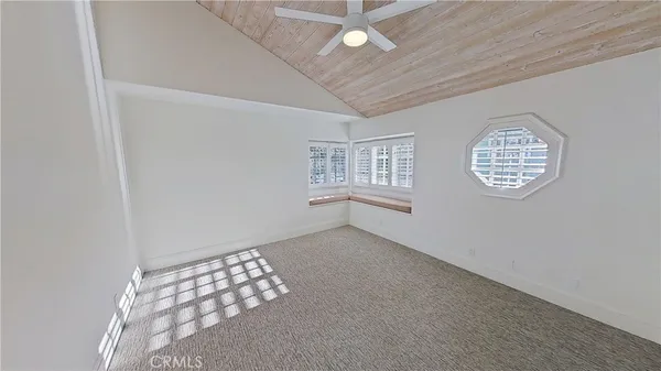 a view of walk in closet with wooden floor