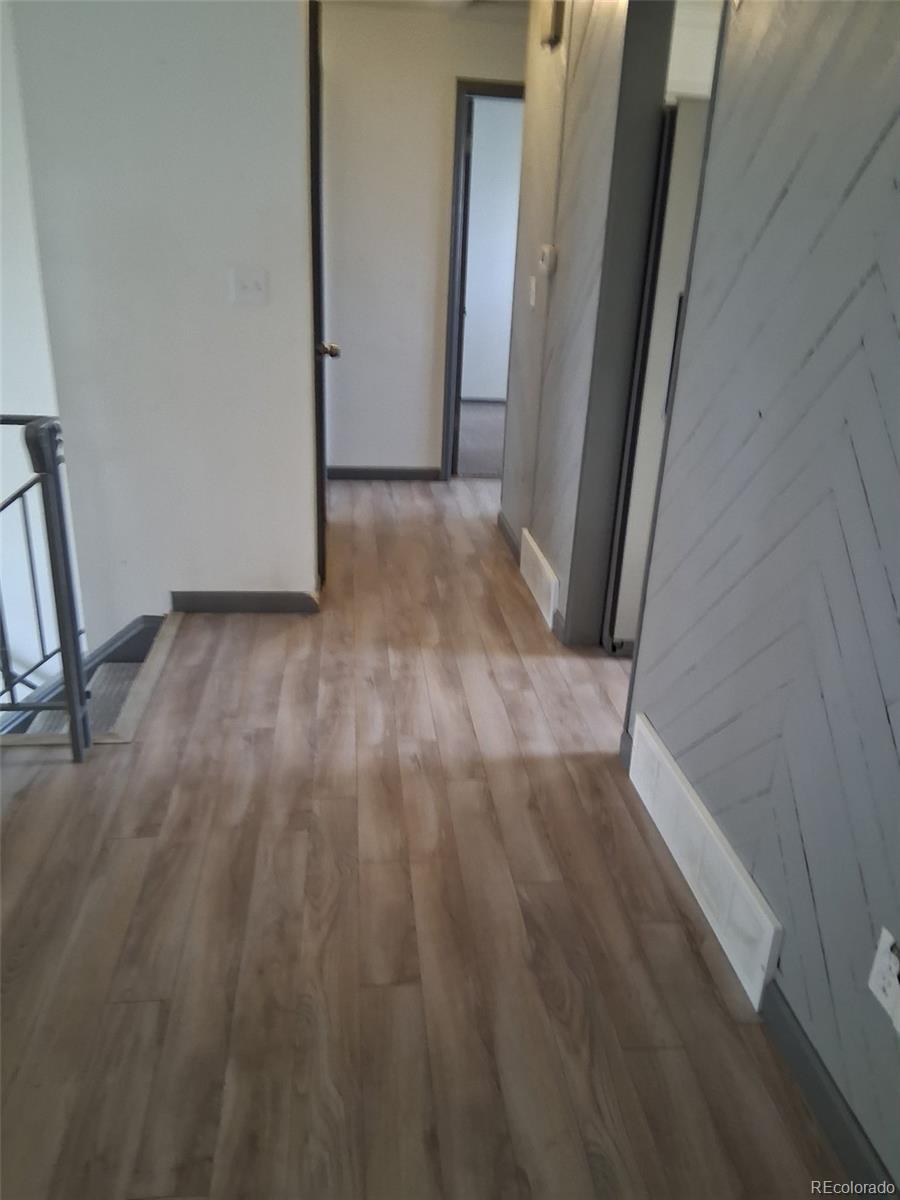 9162 Cody Street Broomfield, CO 80021 - Photo 12 of 29 a view of a hallway