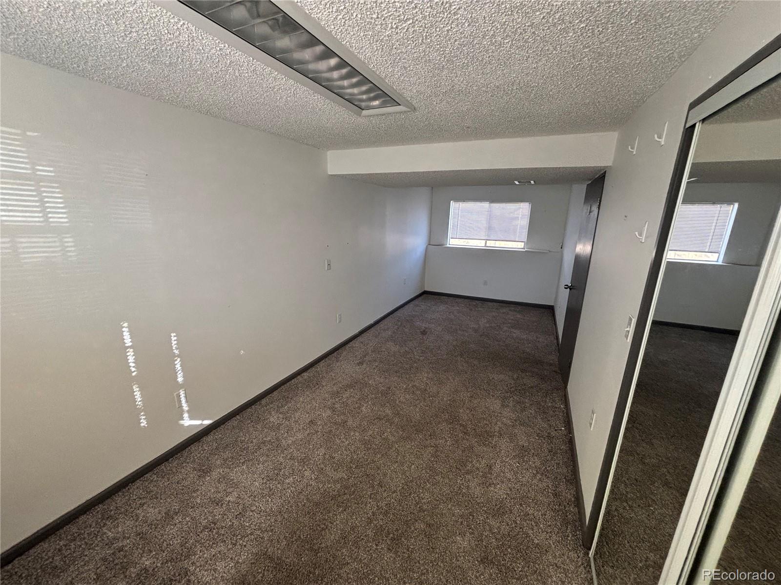 9162 Cody Street Broomfield, CO 80021 - Photo 15 of 29 a view of an empty room