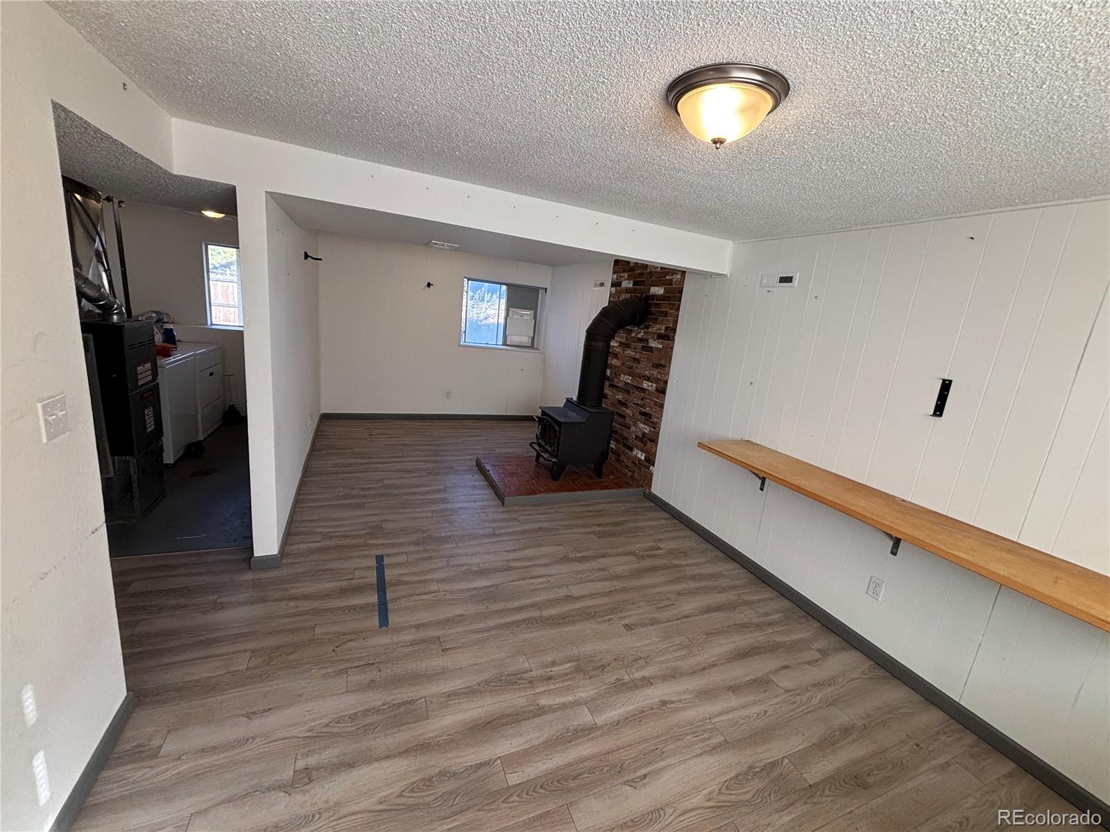 9162 Cody Street Broomfield, CO 80021 - Photo 18 of 29 a view of a room with wooden floor