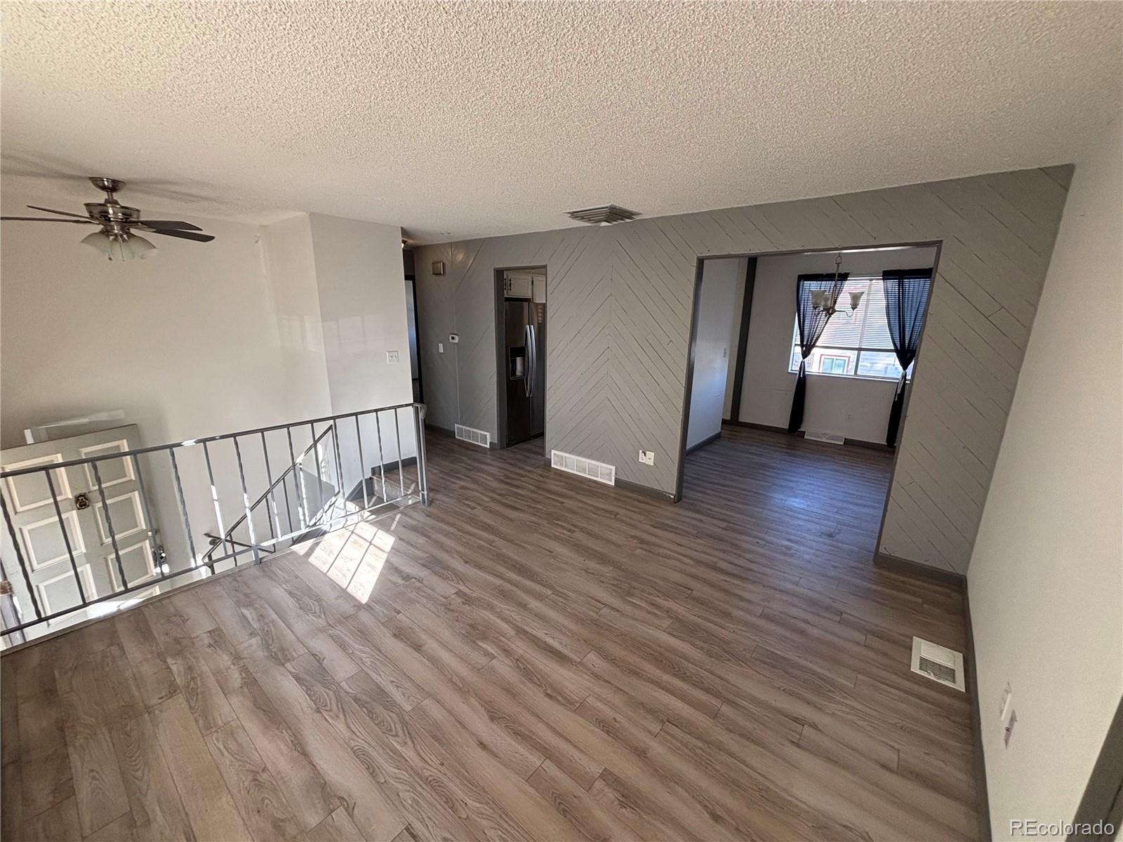 9162 Cody Street Broomfield, CO 80021 - Photo 5 of 29 wooden floor in an empty room
