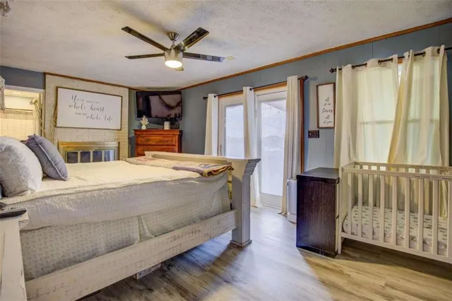 a bedroom with a large bed and a large window